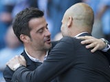 Marco Silva and Pep Guardiola embrace ahead of the Premier League game between Manchester City and Hull City on April 8, 2017