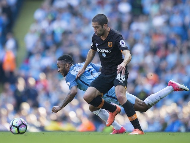 Raheem Sterling and Evandro in action during the Premier League game between Manchester City and Hull City on April 8, 2017
