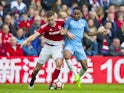 Middlesbrough's Ben Gibson and Manchester City's Raheem Sterling in action in the FA Cup quarter-final on March 11, 2017