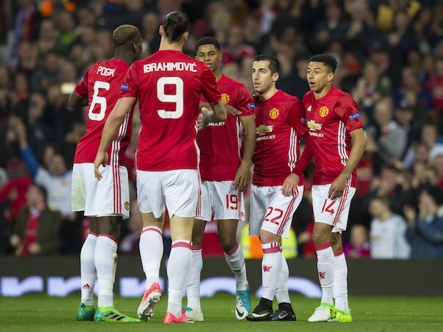 Henrikh Mkhitaryan celebrates with teammates after scoring during the Europa League game between Manchester United and Anderlecht on April 20, 2017