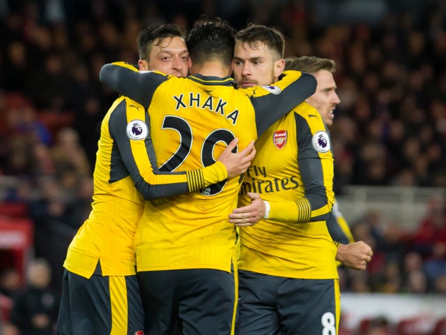 Arsenal midfielder Mesut Ozil celebrates with Granit Xhaka and Aaron Ramsey after scoring during the Premier League clash with Middlesbrough at the Riverside Stadium on April 17, 2017