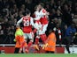 Arsenal players react to Robert Huth's own goal in the Premier League match against Leicester City on April 26, 2016