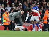Arsenal manager Arsene Wenger appeals to the referee as Alexis Sanchez reacts in pain during the Premier League match against Leicester City on April 26 2017