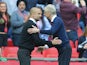 Arsenal's Arsene Wenger offers a hand to Manchester City's Pep Guardiola following the FA Cup semi-final on April 23, 2017