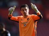 Hull City's Eldin Jakupovic gives a thumbs-up to the crowd after saving a late penalty in the Premier League match against Southampton on April 29, 2017