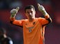 Hull City's Eldin Jakupovic gives a thumbs-up to the crowd after saving a late penalty in the Premier League match against Southampton on April 29, 2017