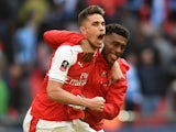 Arsenal's Gabriel Paulista and Alex Iwobi celebrate victory over Manchester City in the FA Cup semi-final on April 23, 2017