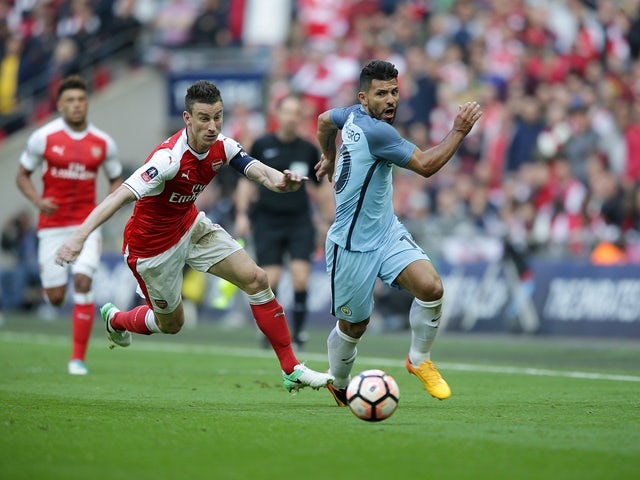 Arsenal's Laurent Koscielny and Manchester City's Sergio Aguero during the FA Cup semi-final on April 23, 2017
