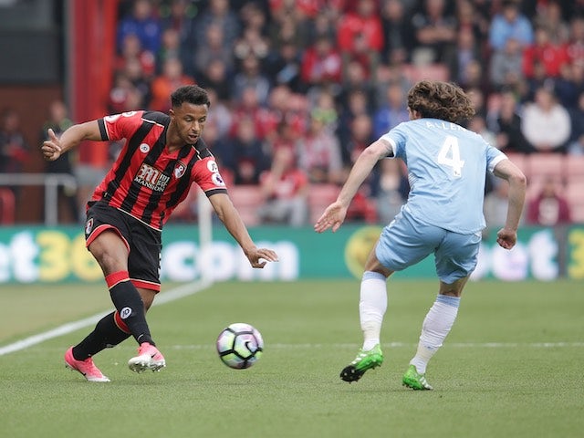 Lys Mousset and Joe Allen in action during the Premier League game between Bournemouth and Stoke City on May 6, 2017