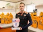 Newport County defender Mickey Demetriou poses with his League Two player of the month award for April 2017