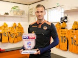Newport County defender Mickey Demetriou poses with his League Two player of the month award for April 2017