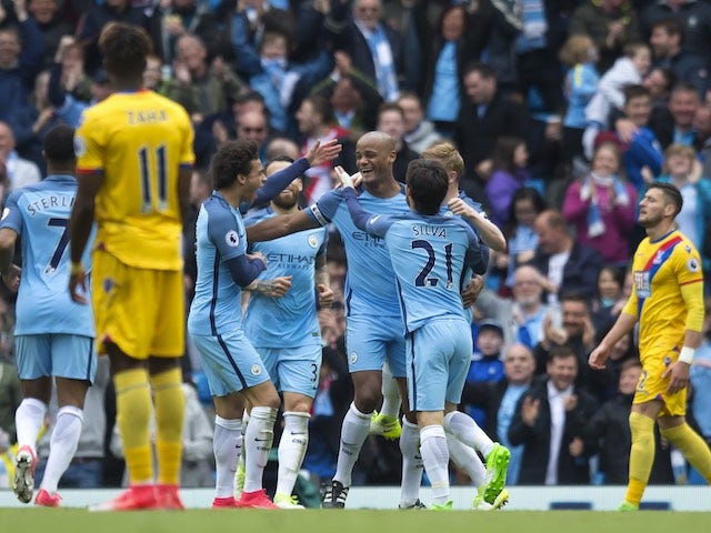 Vincent Kompany celebrates scoring with teammates during the Premier League game between Manchester City and Crystal Palace on May 6, 2017