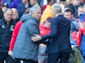 Arsene Wenger and Joe Mourinho shake hands during the Premier League game between Arsenal and Manchester United on May 7, 2017
