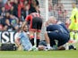 A floored Joe Allen receives treatment during the Premier League game between Bournemouth and Stoke City on May 6, 2017
