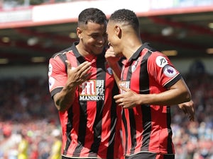 Joshua King congratulates Junior Stanislas during the Premier League game between Bournemouth and Burnley on May 13, 2017