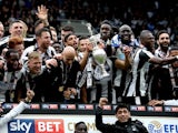 Newcastle United players celebrate being crowned champions of the Championship on May 7, 2017