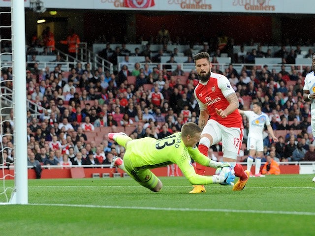 Jordan Pickford saves a shot from Olivier Giroud during the Premier League game between Arsenal and Sunderland on May 16, 2017