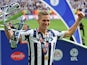 Millwall's Steve Morison holds the trophy after their League One playoff final victory over Bradford City on May 20, 2017