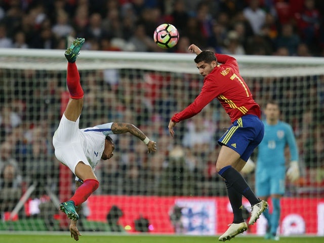 Spain survive scare to stay top