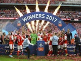 Arsenal celebrate with the trophy after winning the FA Cup final against Chelsea on May 27, 2017