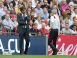 Antonio Conte and windswept Arsene Wenger during the FA Cup final between Arsenal and Chelsea on May 27, 2017