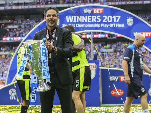 David Wagner poses with the trophy after Huddersfield Town win promotion to the Premier League on May 29, 2017