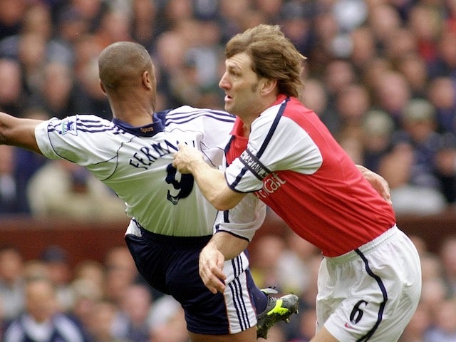 Tony Adams tussles with Les Ferdinand in 2001