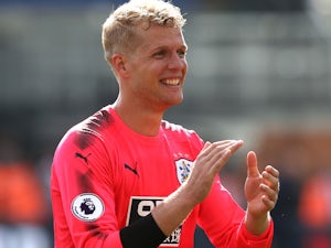 Terriers keeper Jonas Lossl celebrates after the Premier League game between Crystal Palace and Huddersfield Town on August 12, 2017