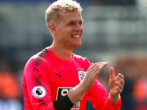 Terriers keeper Jonas Lossl celebrates after the Premier League game between Crystal Palace and Huddersfield Town on August 12, 2017