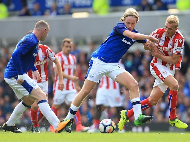 Tom Davies battles with Darren Fletcher during the Premier League game between Everton and Stoke City on August 12, 2017