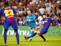 Cristiano Ronaldo scores past Gerard Pique during the Supercopa de Espana first-leg match between Barcelona and Real Madrid on August 13, 2017