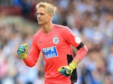 Jonas Lossl in action during the Premier League game between Huddersfield Town and Newcastle United on August 20, 2017