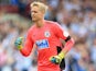 Jonas Lossl in action during the Premier League game between Huddersfield Town and Newcastle United on August 20, 2017
