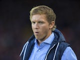 A chillaxed Julian Nagelsmann watches on during the Champions League playoff between Liverpool and Hoffenheim on August 23, 2017