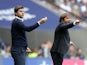 Mauricio Pochettino and Antonio Conte give instructions during the Premier League game between Tottenham Hotspur and Chelsea on August 20, 2017