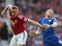 Phil Jones and Jamie Vardy in action during the Premier League game between Manchester United and Leicester City on August 26, 2017