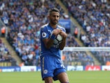 Riyad Mahrez clutches the ball during the Premier League game between Leicester City and Brighton & Hove Albion on August 19, 2017