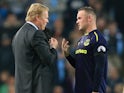 Ronald Koeman chats to Wayne Rooney during the Premier League game between Manchester City and Everton on August 21, 2017