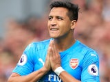 Alexis Sanchez prays during the Premier League game between Liverpool and Arsenal on August 27, 2017