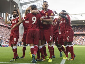 Mohamed Salah celebrates with teammates after scoring during the Premier League game between Liverpool and Arsenal on August 27, 2017