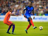 Paul Pogba is pursued by Georginio Wijnaldum during the World Cup qualifier between France and the Netherlands on August 31, 2017