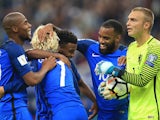 Thomas Lemar celebrates with teammates after scoring during the World Cup qualifier between France and the Netherlands on August 31, 2017