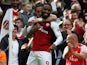 Alexandre Lacazette is congratulated by Hector Bellerin after scoring during the Premier League game between Arsenal and Bournemouth on September 9, 2017