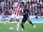 Eric Maxim Choupo-Moting and Antonio Valencia in action during the Premier League game between Stoke City and Manchester United on September 9, 2017