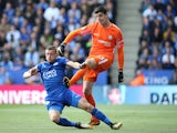 Jamie Vardy and Thibaut Courtois in action during the Premier League game between Leicester City and Chelsea on September 9, 2017