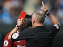 Jon Moss hands Sadio Mane a red card during the Premier League game between Manchester City and Liverpool on September 9, 2017