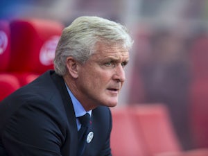 Hughes 'expecting strong Chelsea side'