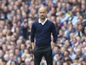 Pep Guardiola watches on during the Premier League game between Manchester City and Liverpool on September 9, 2017