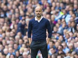 Pep Guardiola watches on during the Premier League game between Manchester City and Liverpool on September 9, 2017