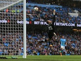 Simon Mignolet dives in vain as City score their fifth during the Premier League game between Manchester City and Liverpool on September 9, 2017